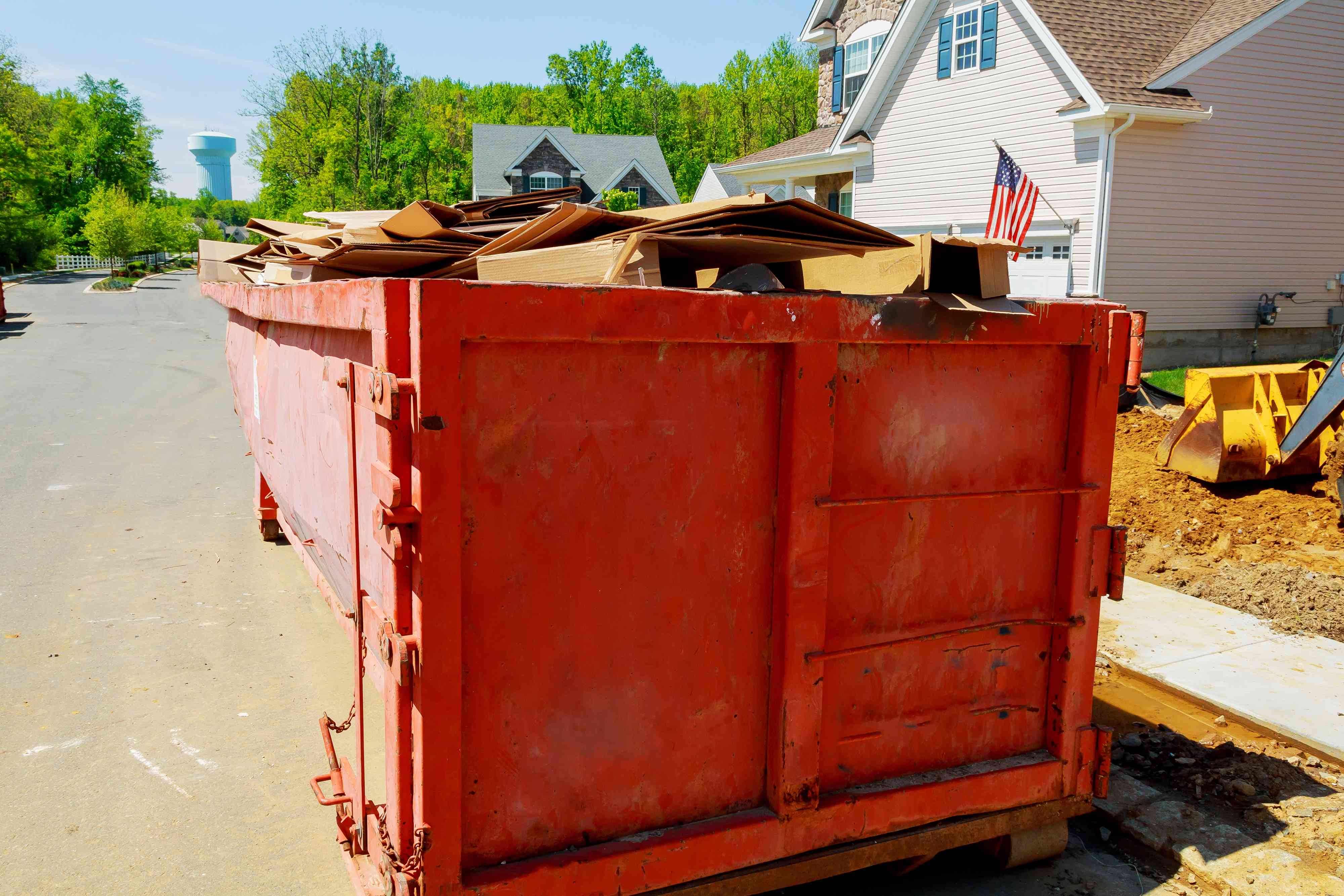 loaded-dumpster-near-a-construction-home-renovation_TC--8TJju